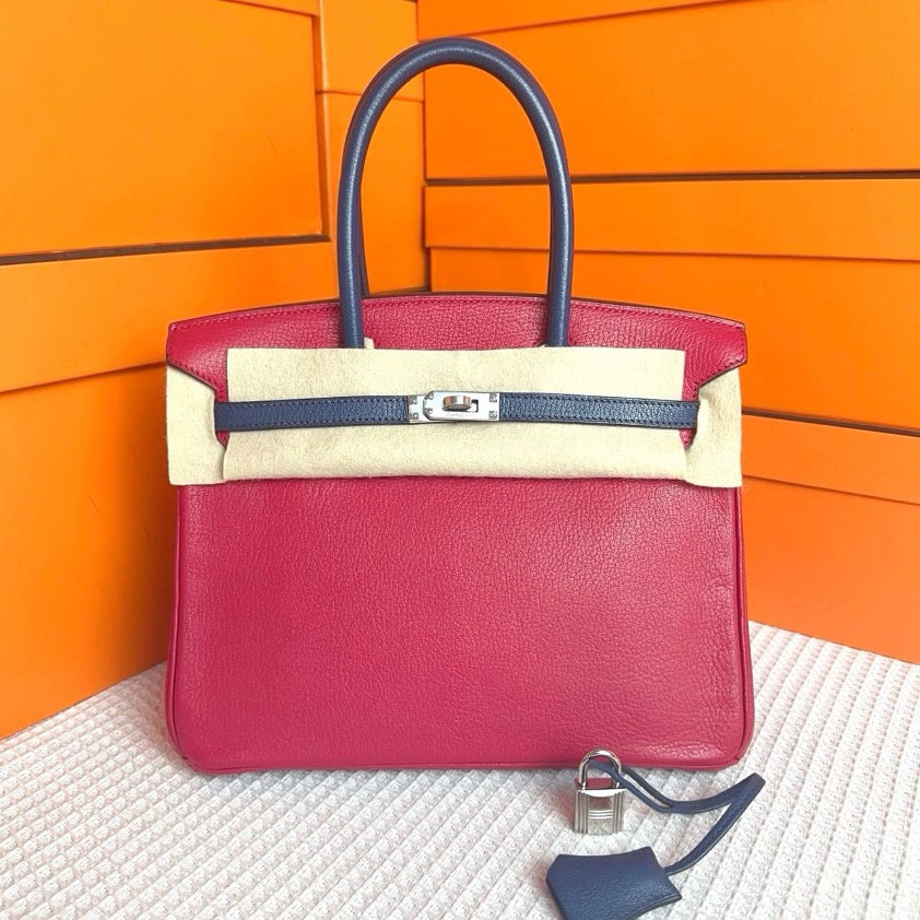 *Hermes Birkin 25, ultra-pink and midnight blue color scheme, goatskin leather, silver hardware, engraved frame. SYC2167