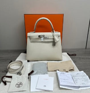 HERMES Kelly 28 shoulder/crossbody bag with silver hardware and milkshake design. 3022604183054