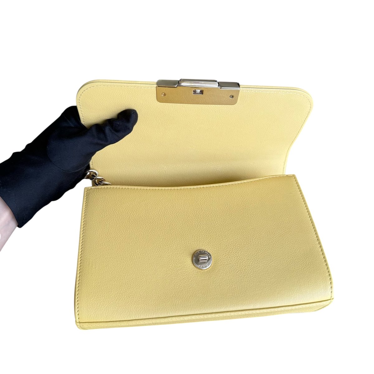 Luxury Evermore Chanel Label Click small handbag in yellow grained calfskin with gold hardware, interior view.