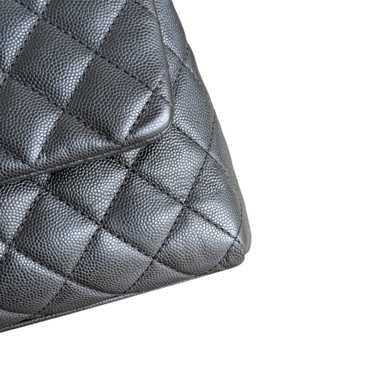 Luxury Evermore Chanel Coco Handle medium handbag in black quilted caviar leather with a close-up texture view.