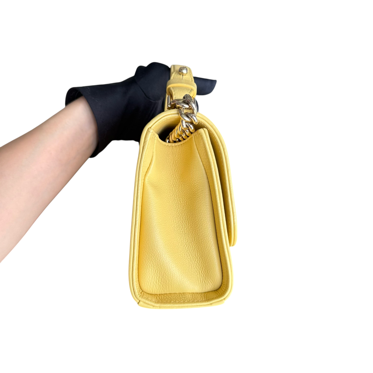 Luxury Evermore Chanel Label Click small bag in yellow quilted grained calfskin with gold hardware, side view.