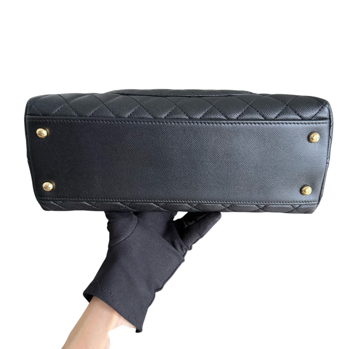 Luxury Evermore Chanel Coco Handle medium bag base view featuring black quilted caviar leather and gold tone feet