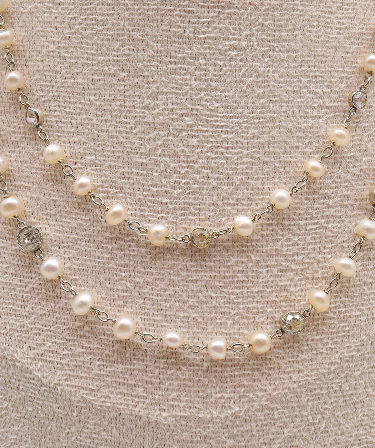 An Art Deco Pearl and Diamond Chain WA25672