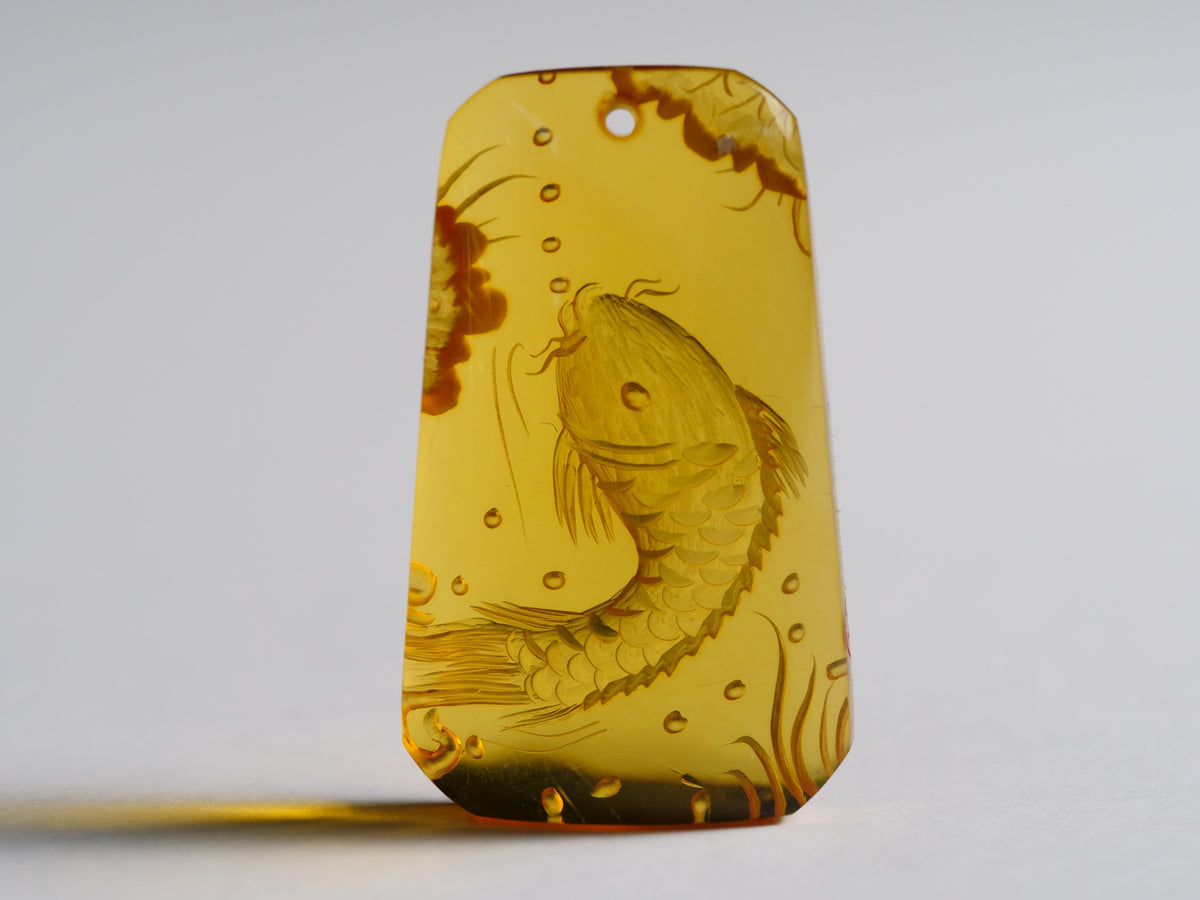 Yihen Natural Amber master carving 'Longmen Gate'. 35 x 20mm. 23.75ct.