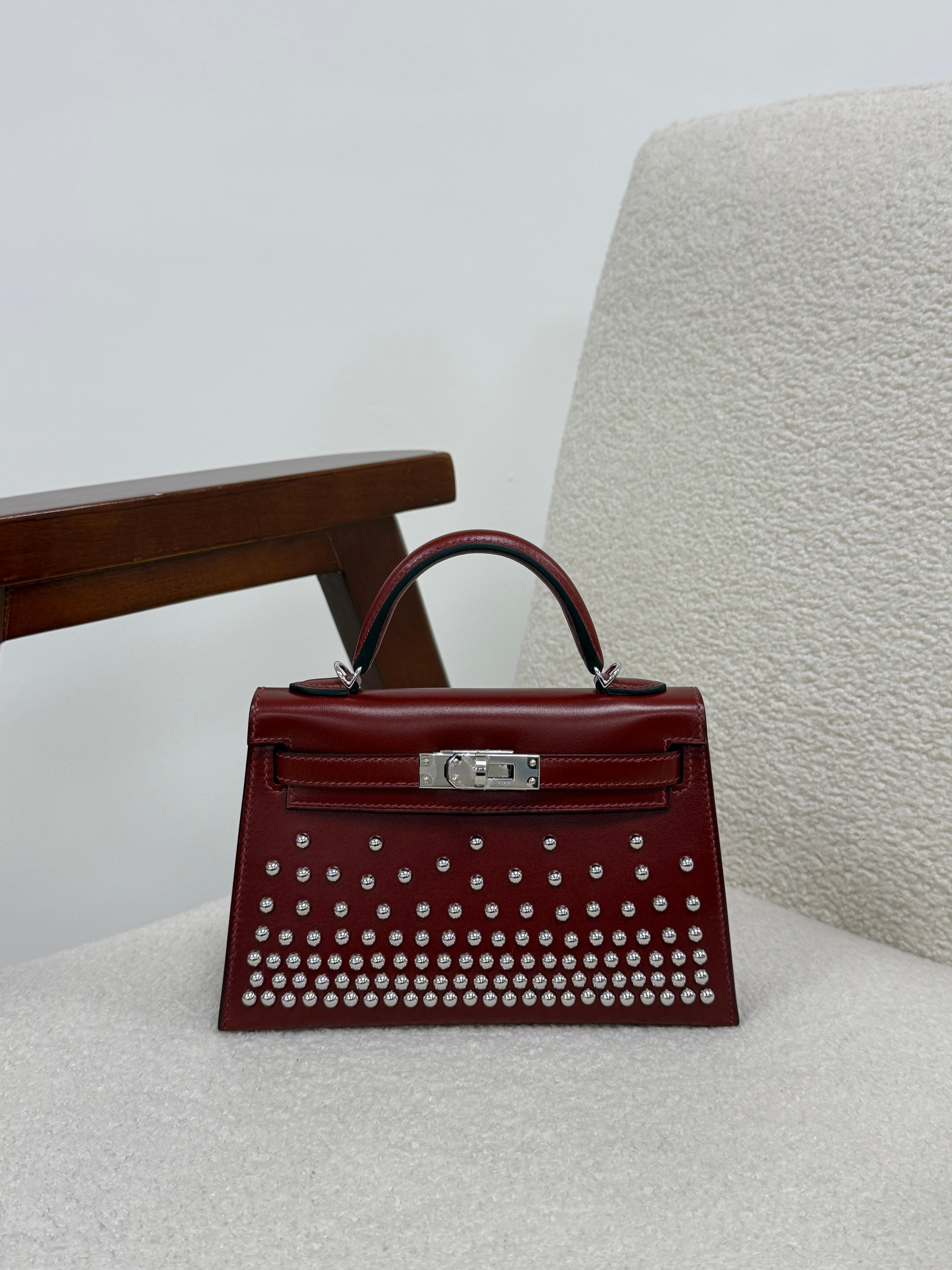 Aureon Group Limited *LONDON LOCATED* HERMÈS MINI KELLY II 20CM "CLOUTE" ROUGE H Box Leather with Palladium Hardware