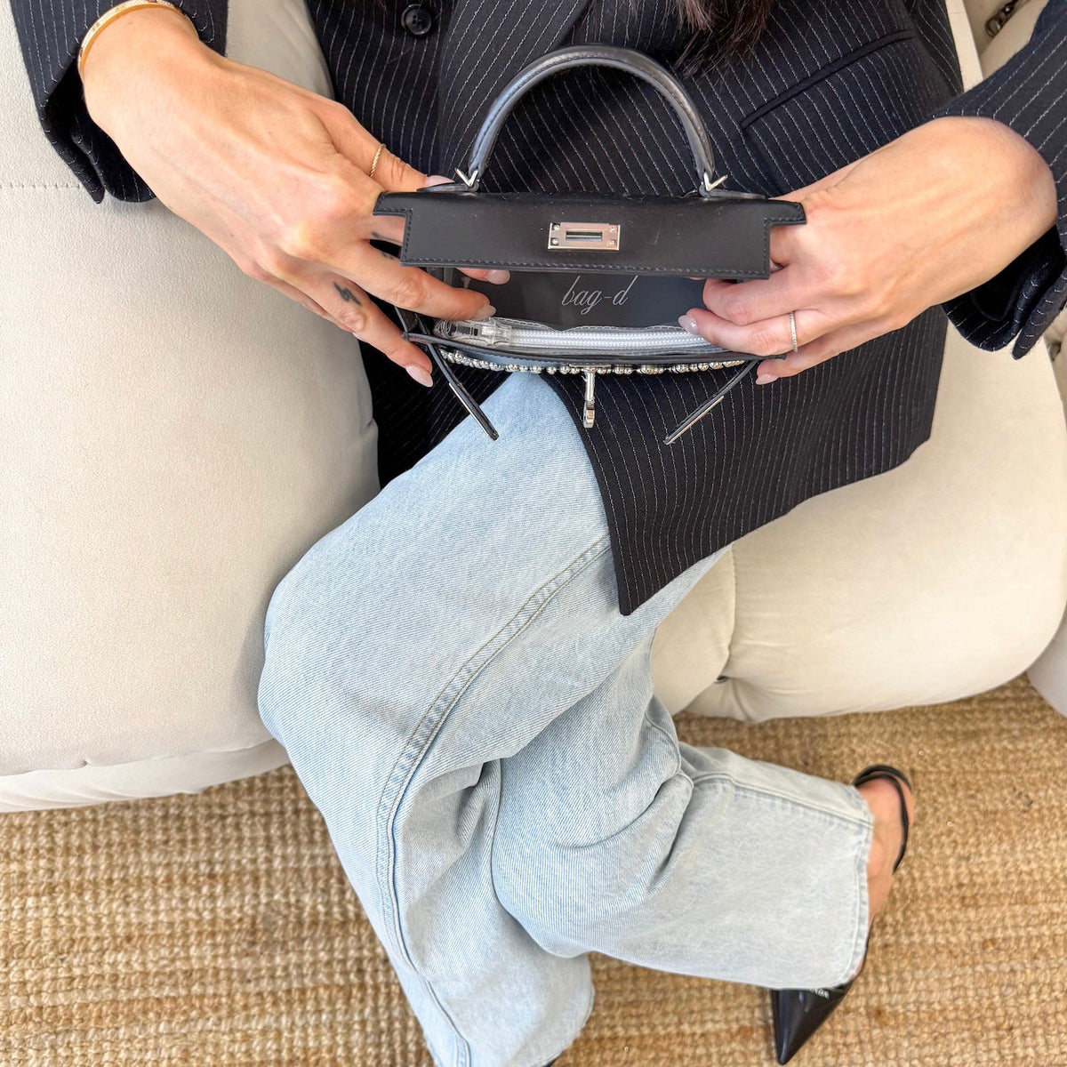 model wears bag-d-tpu-insert-hermes-mini-kelly