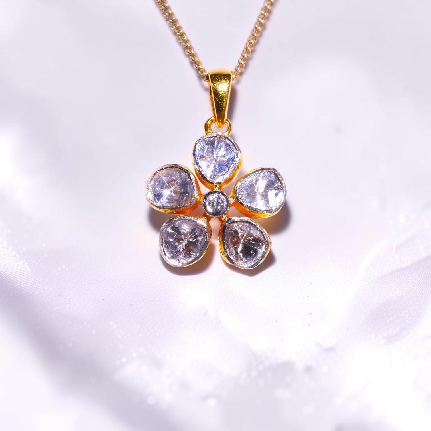 Gold flower pendant set with uncut polki diamonds