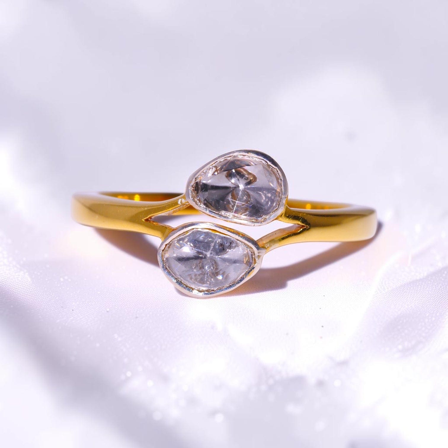 Gold ring set with two uncut polki diamonds