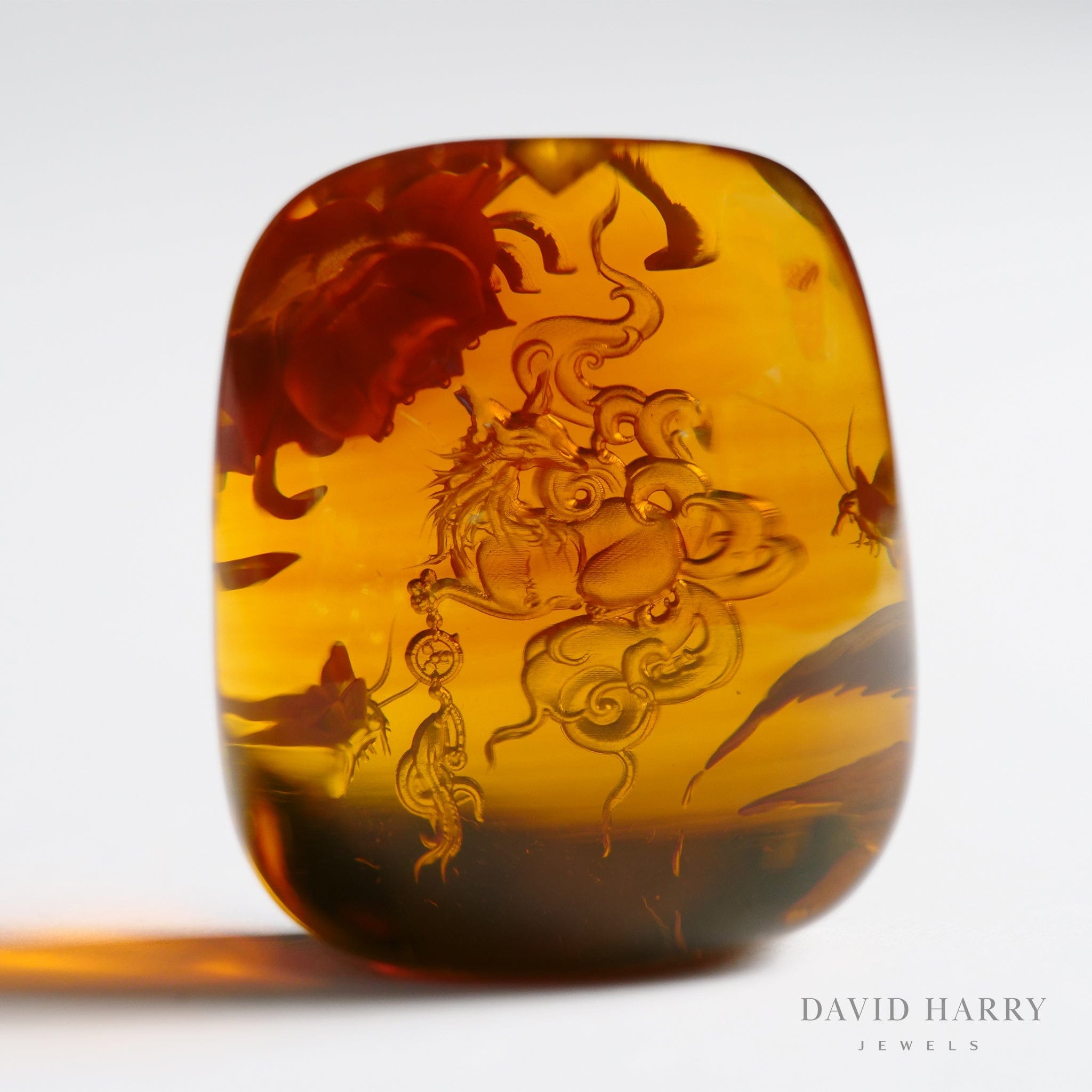David Harry Jewels Yihen Natural Amber master carving 'Jiuweihu'. 32 x 25mm. 94.6 cts.