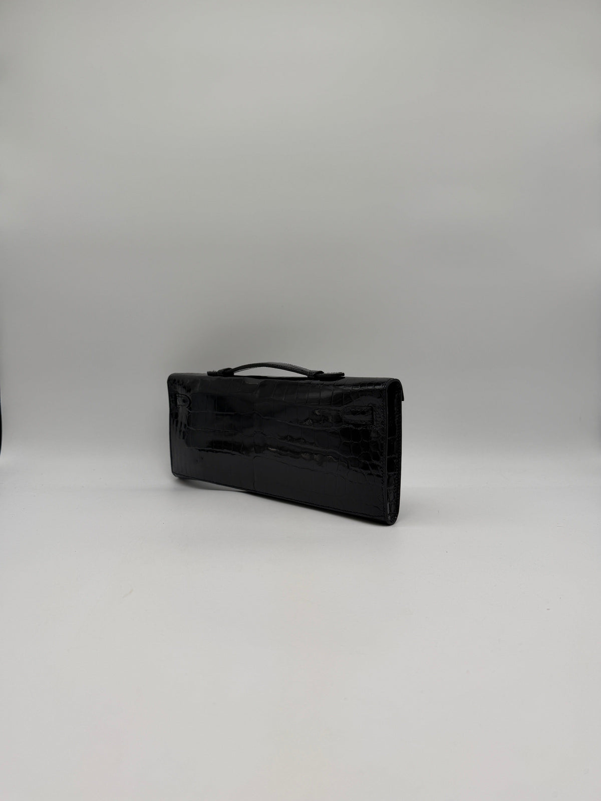 Prime Concierge Hermès Kelly Cut Black Shiny Porosus Palladium Hardware
