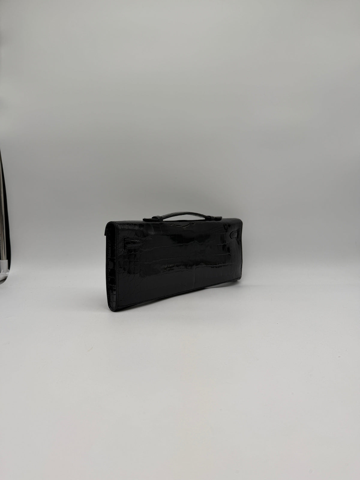 Prime Concierge Hermès Kelly Cut Black Shiny Porosus Palladium Hardware