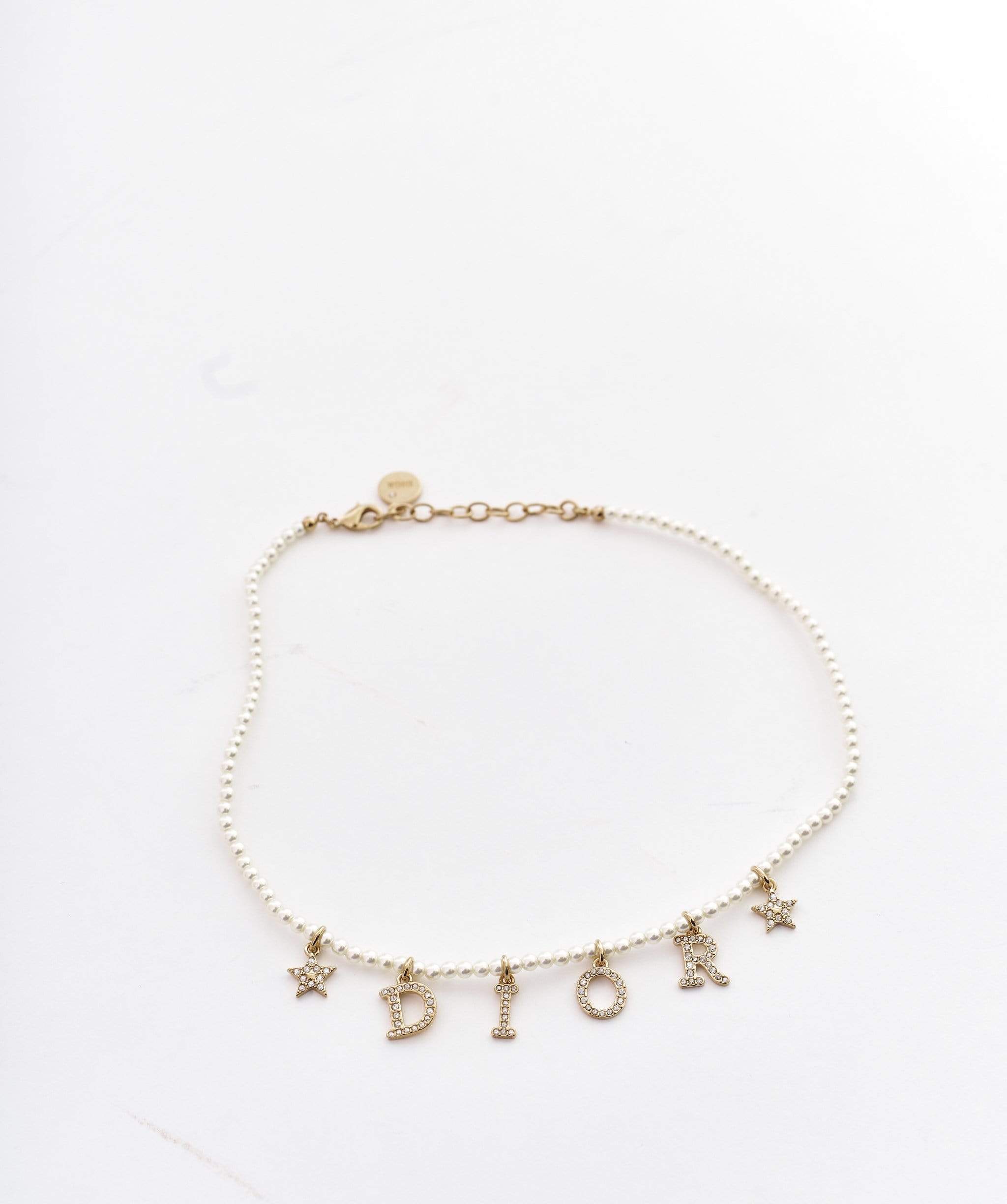 Christian Dior pearl necklace with gold ‘DIOR’ and stars – Luxury