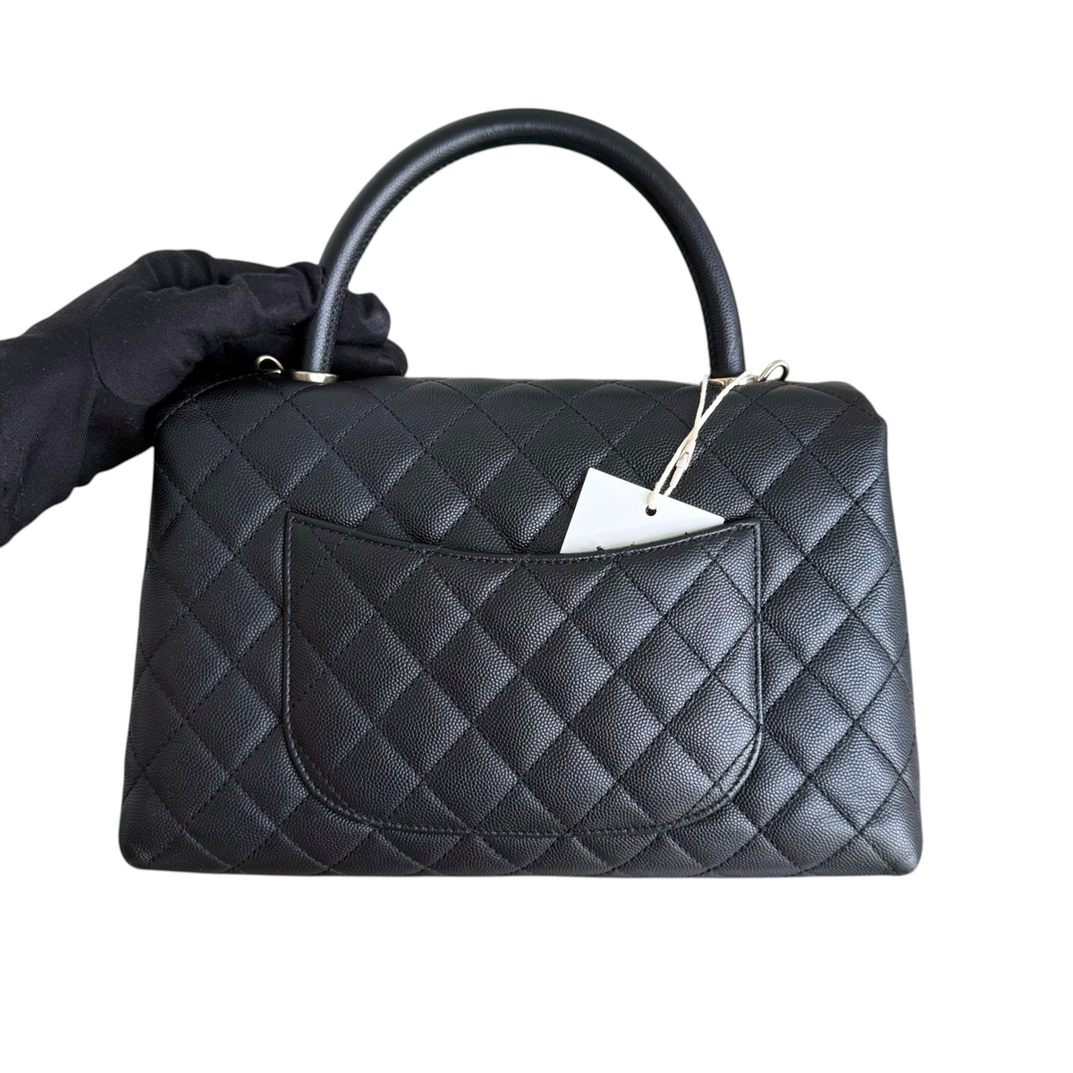 Luxury Evermore pre-loved black quilted caviar leather Chanel Coco Handle medium handbag with gold hardware