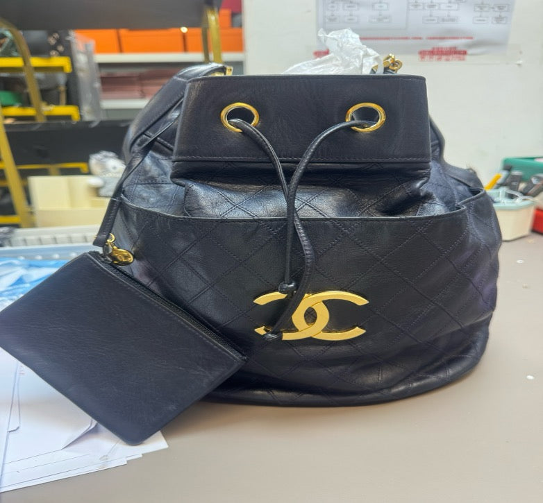 Chanel blue vintage leather bucket bag, size 28 (116 opening, no card/sub-pocket). 24947598