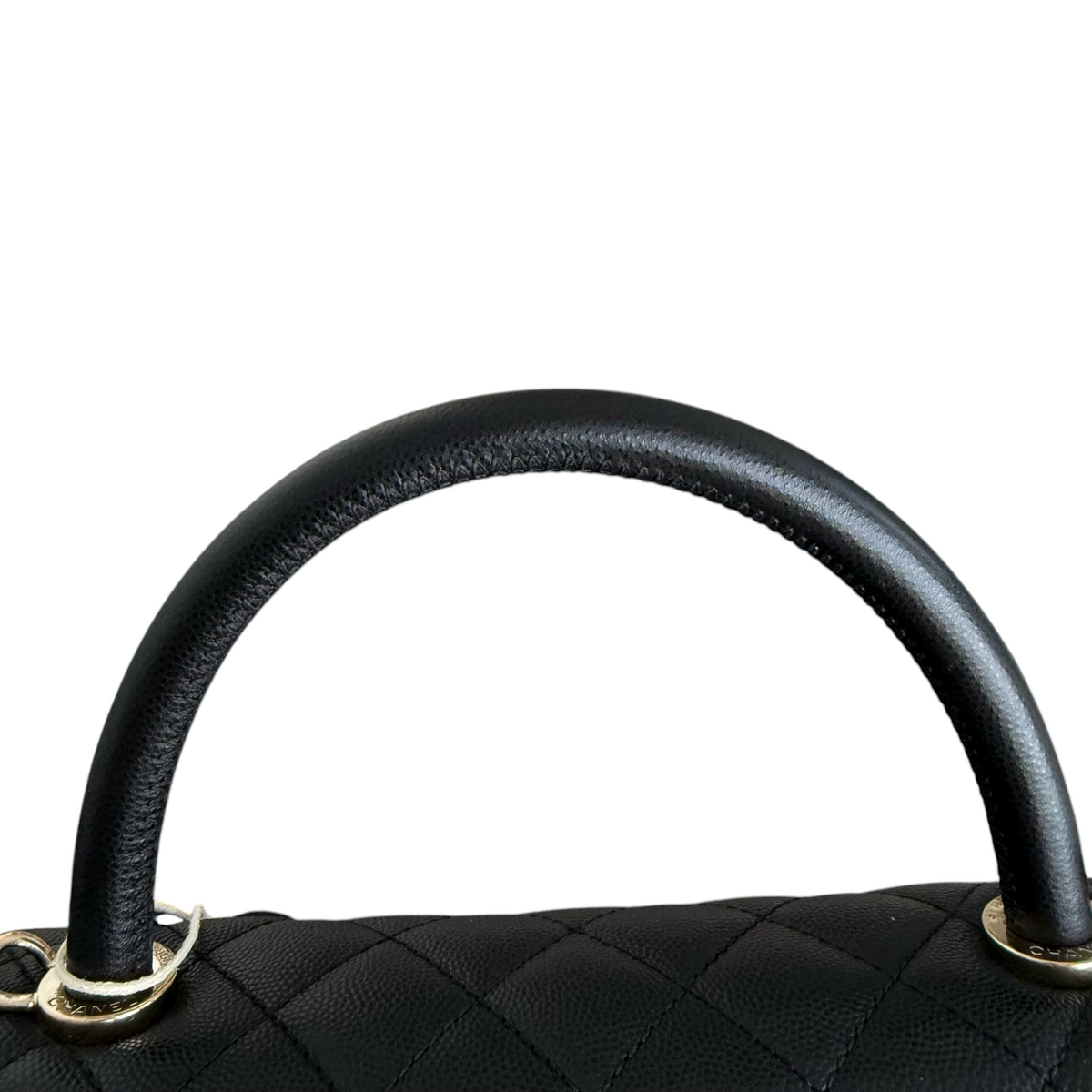 Luxury Evermore Chanel Coco Handle bag top handle detail in black quilted caviar leather with gold hardware