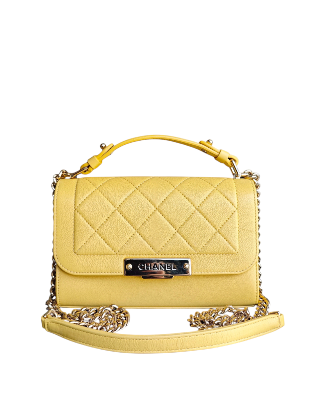 Luxury Evermore Chanel Label Click small bag in yellow quilted grained calfskin with gold hardware and top handle.