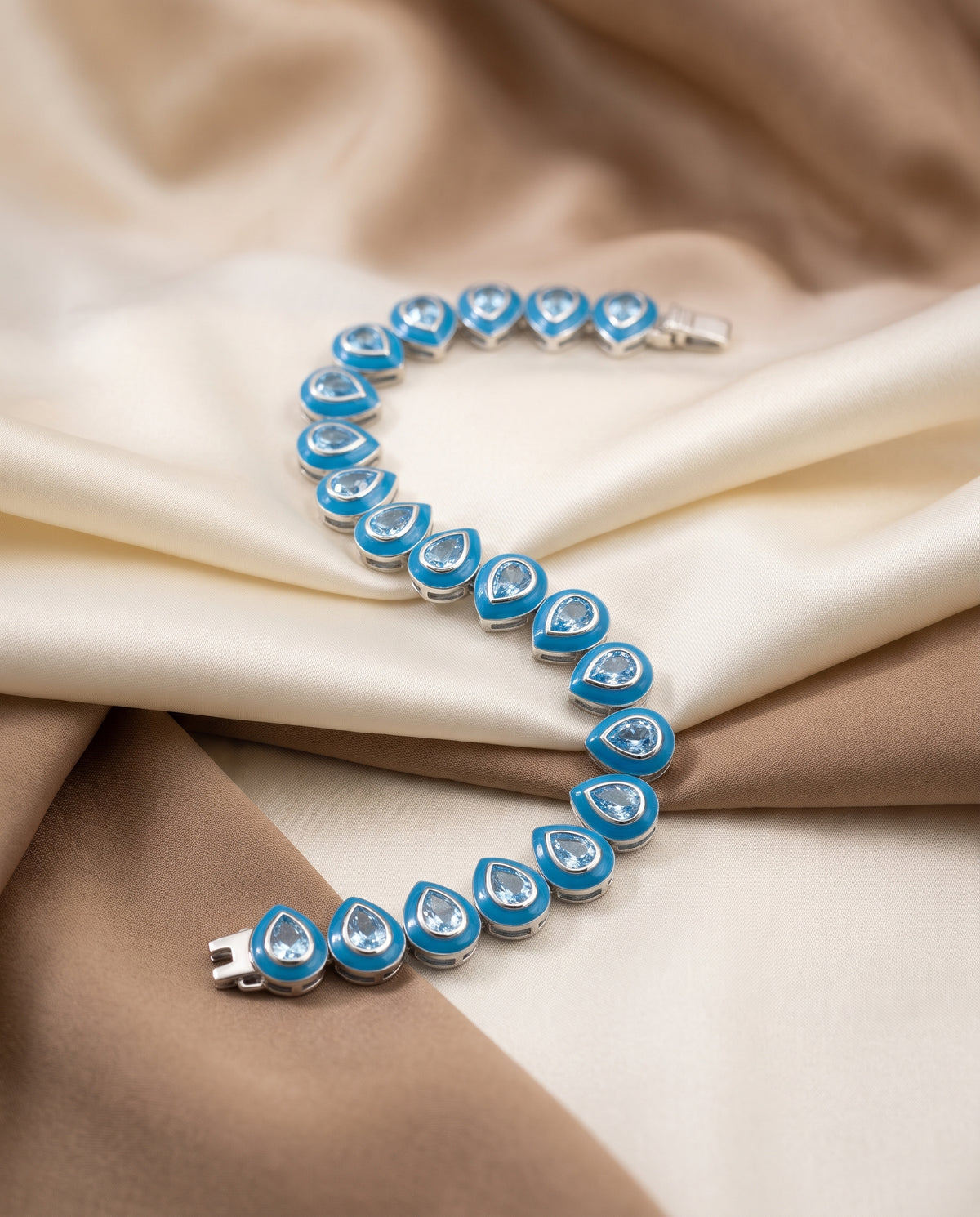 Dakry - 10crts Blue Topaz Pear Bracelet  HOA010
