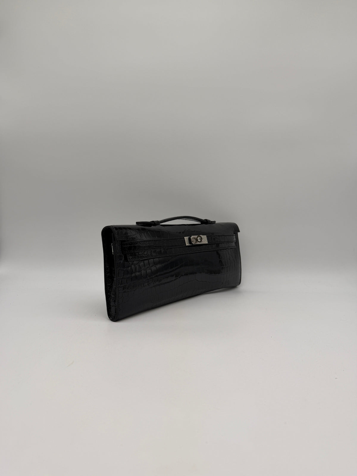 Hermès Kelly Cut Black Shiny Porosus Palladium Hardware