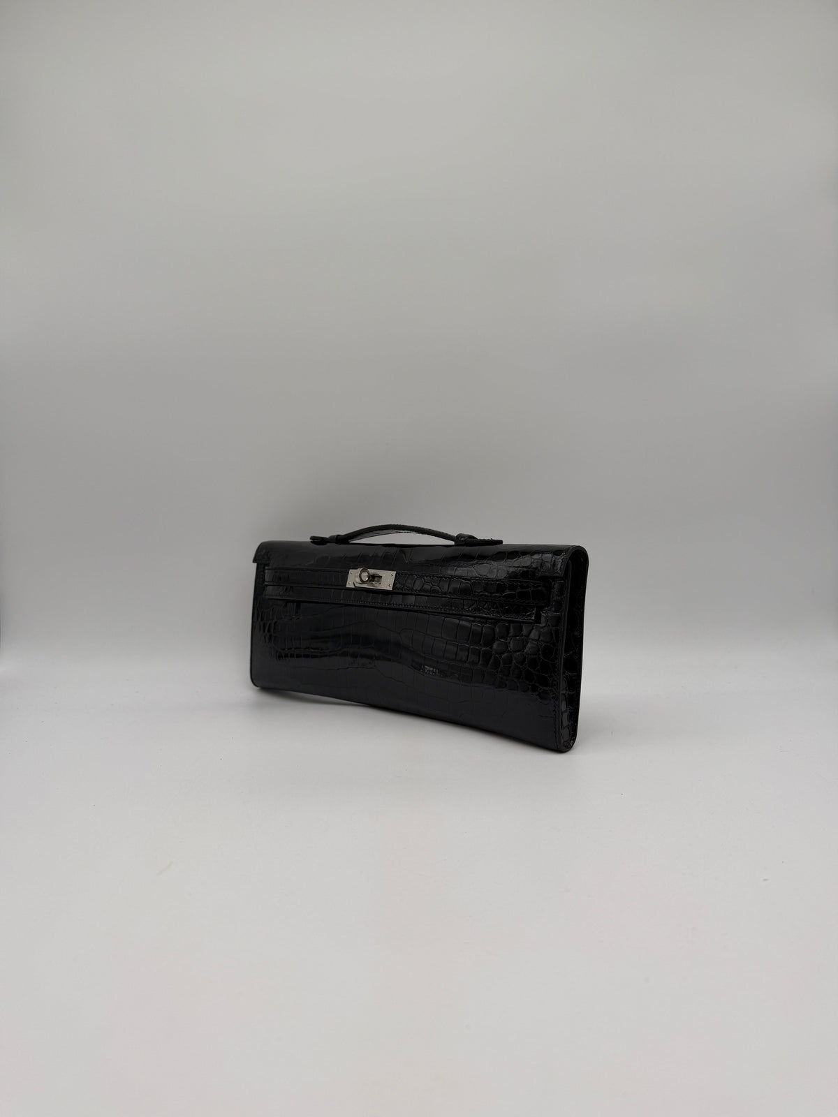 Hermès Kelly Cut Black Shiny Porosus Palladium Hardware