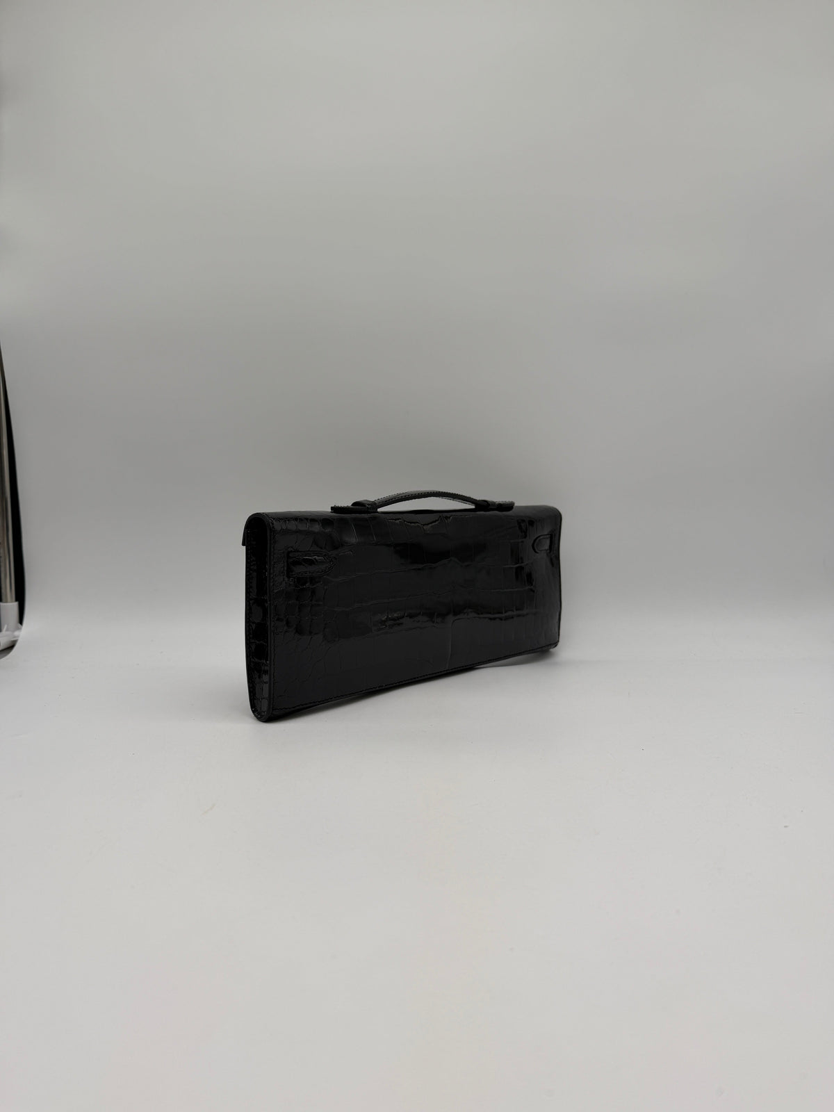 Hermès Kelly Cut Black Shiny Porosus Palladium Hardware