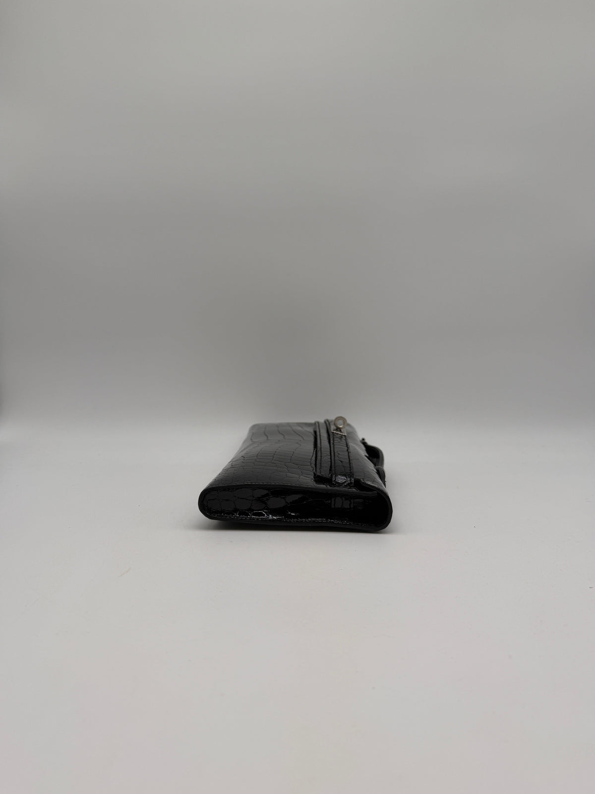 Hermès Kelly Cut Black Shiny Porosus Palladium Hardware