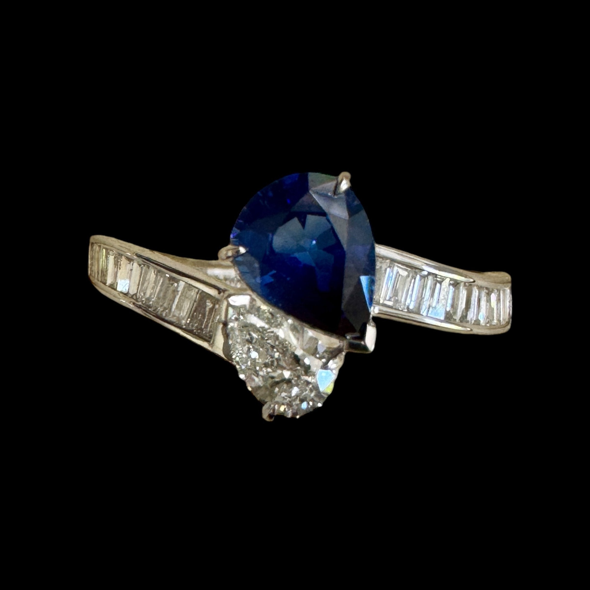 Pear Shaped Sapphire & Diamond Wrap Ring set in 18K White Gold