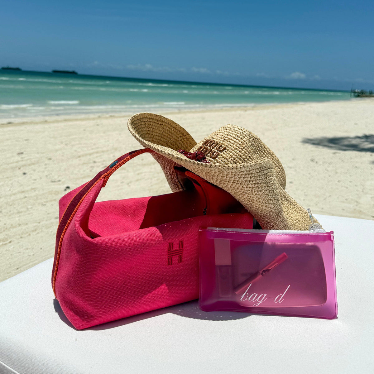bagd_everything_pouch_dark pink_tpu_front miu miu beach hat