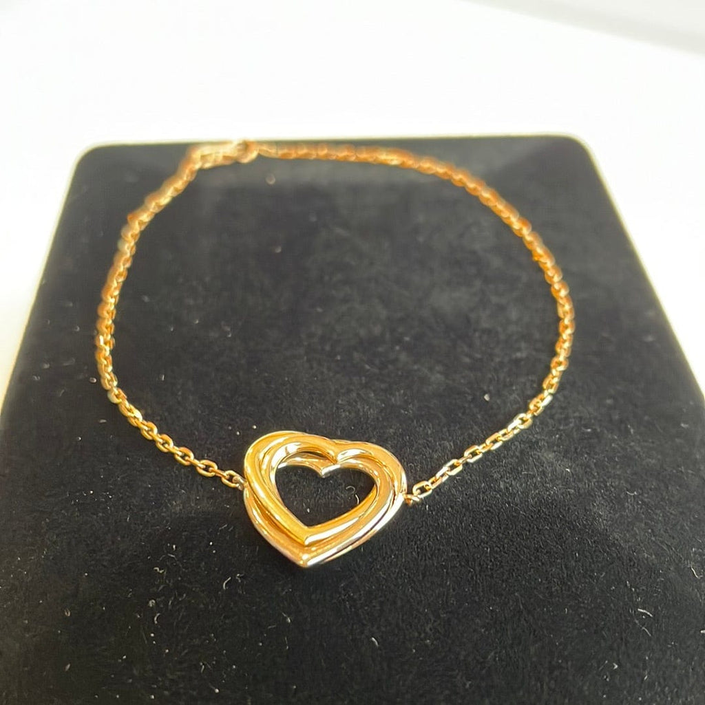 A Heart Bracelet by Cartier The 18ct yellow gold bracelet with alternating  heart design is by Carti