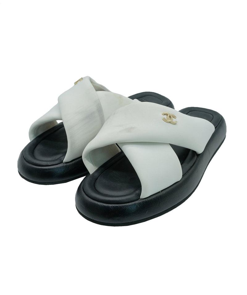 Chanel black store and white slides