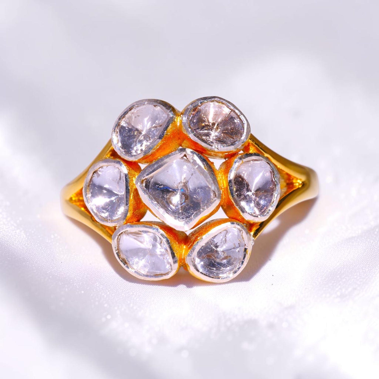 Gold cluster ring set with seven uncut polki diamonds