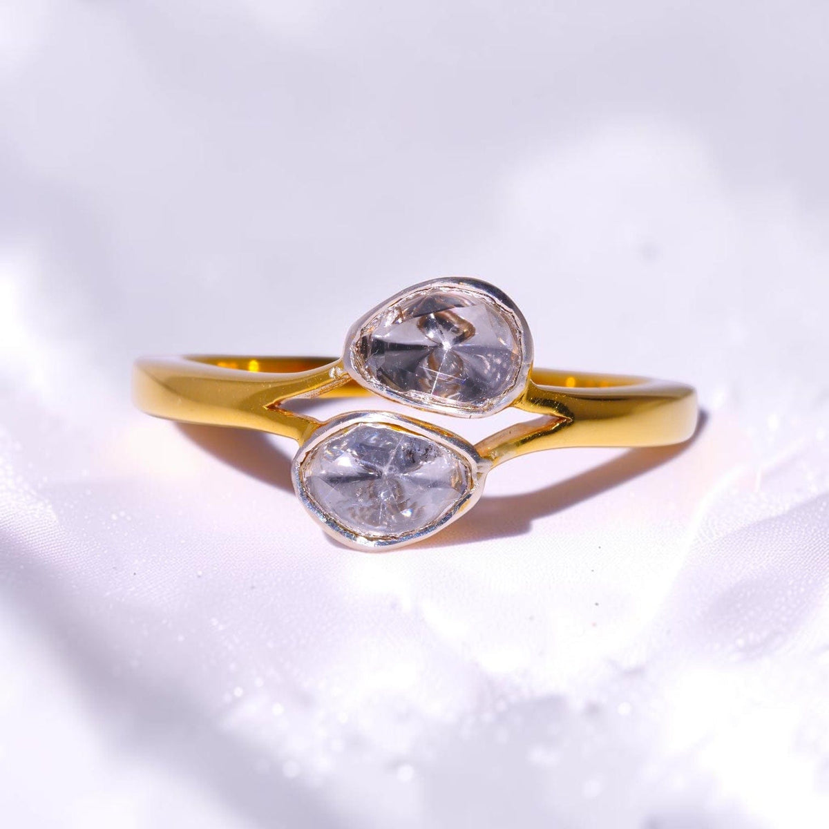 Gold ring set with two uncut polki diamonds