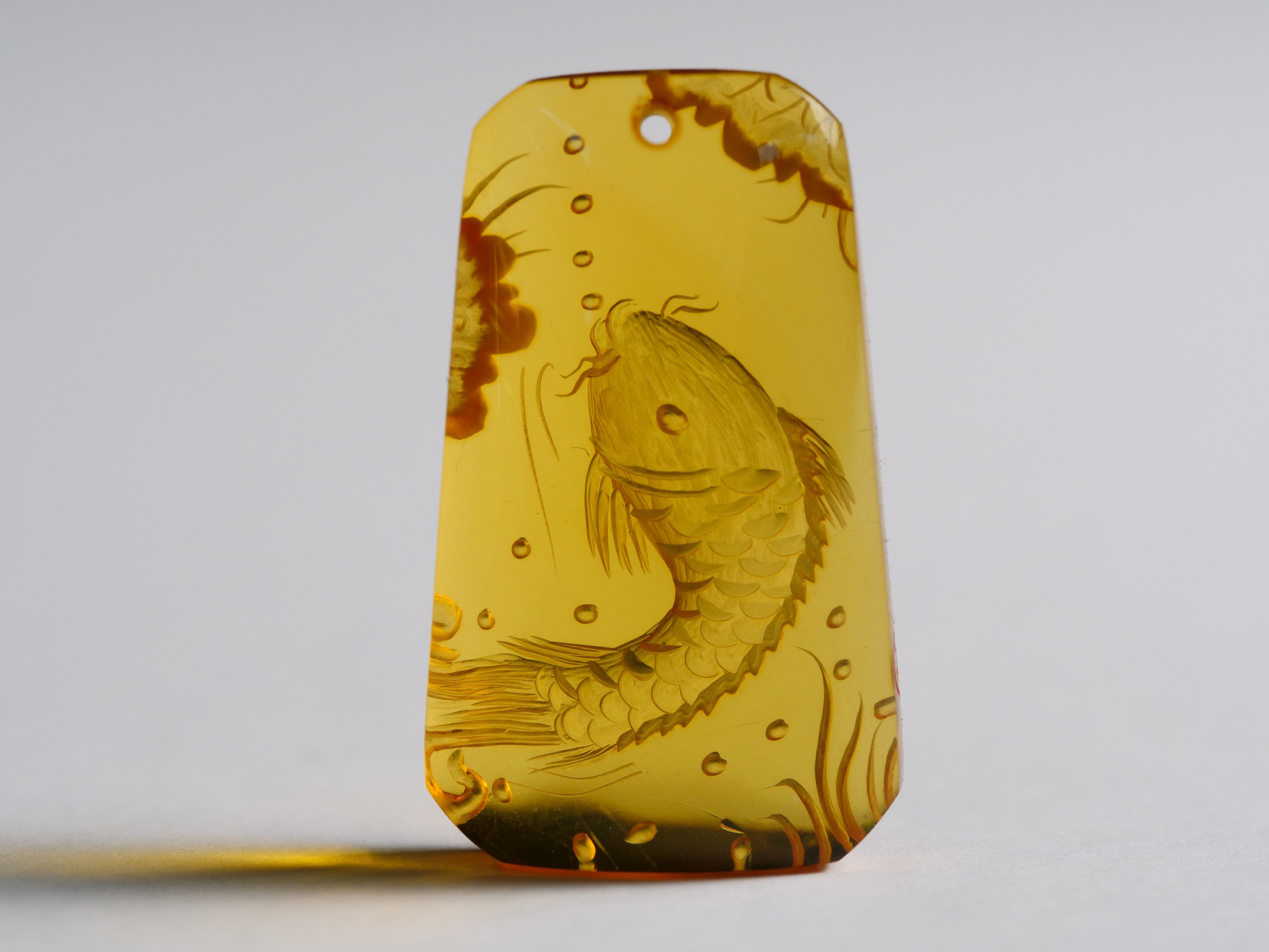 David Harry Jewels Yihen Natural Amber master carving 'Longmen Gate'. 35 x 20mm. 23.75 cts.