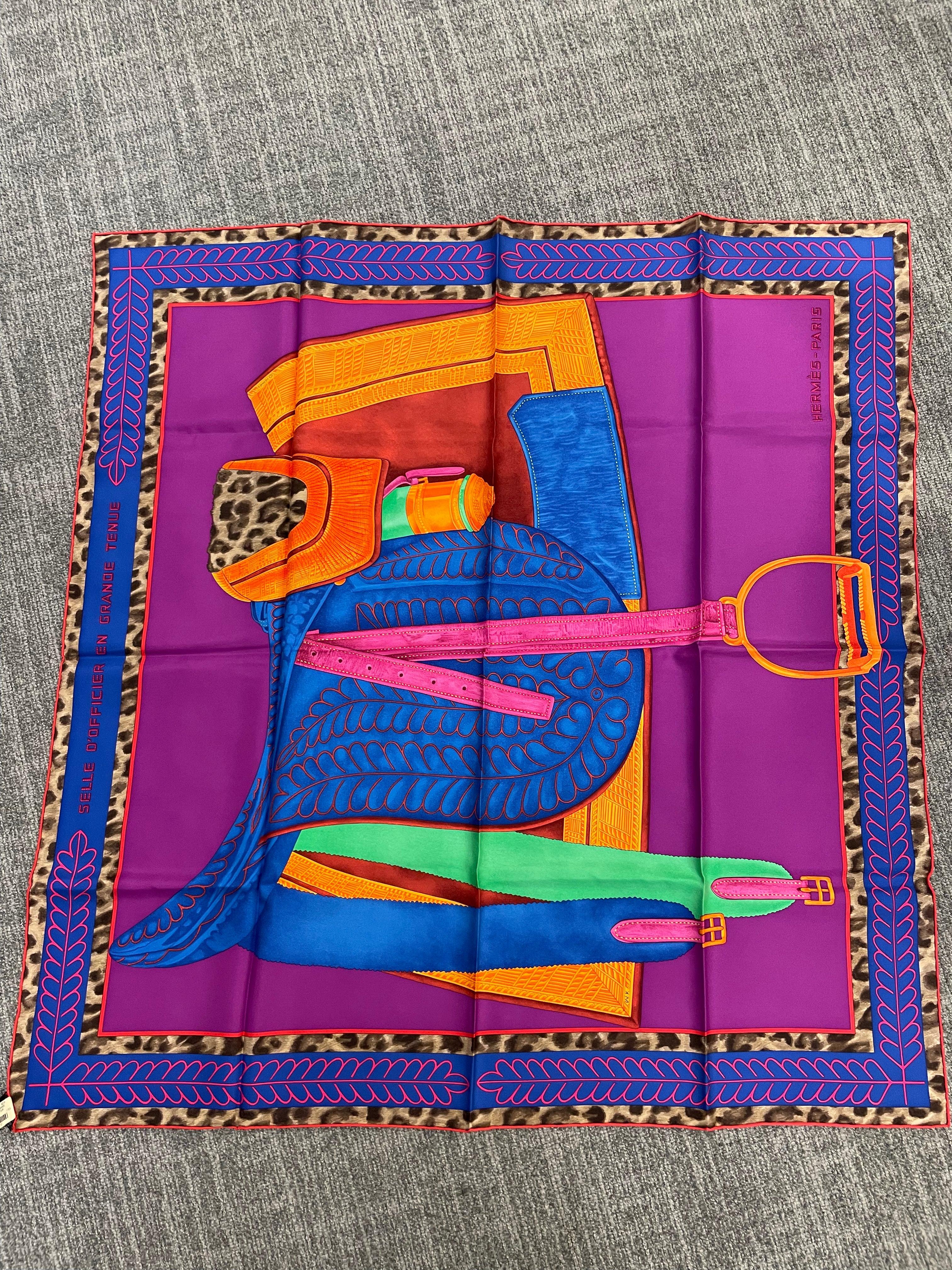 Hermès Hermès Silk 90-24 – Bold Saddle Motif in Purple, Gold, and Cobalt Blue ALC3505