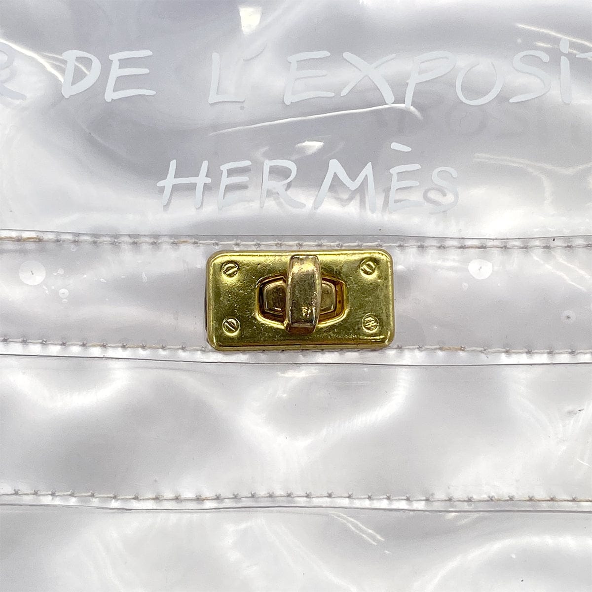 HERMES HERMES VINYL KELLY SOUVENIR DE L' EXPOSITION 1997 CLEAR HAND BAG GOLD HARDWARE 90327409