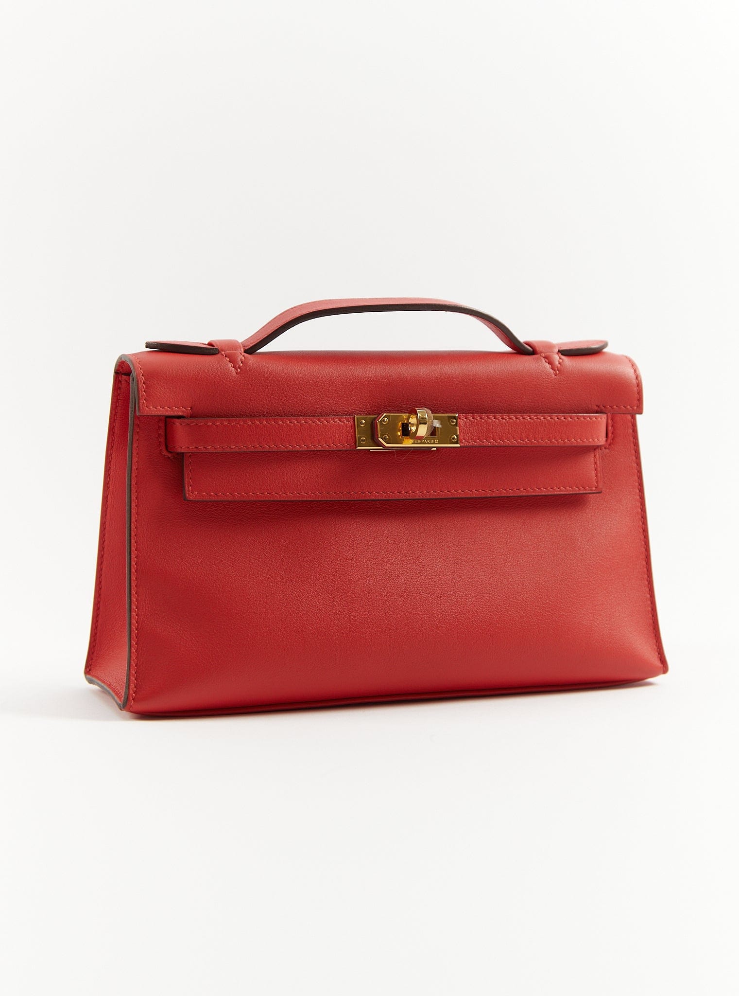 Hermès PRELOVED RARE HERMÈS KELLY POCHETTE ROUGE TOMATE Swift Leather with Gold Hardware