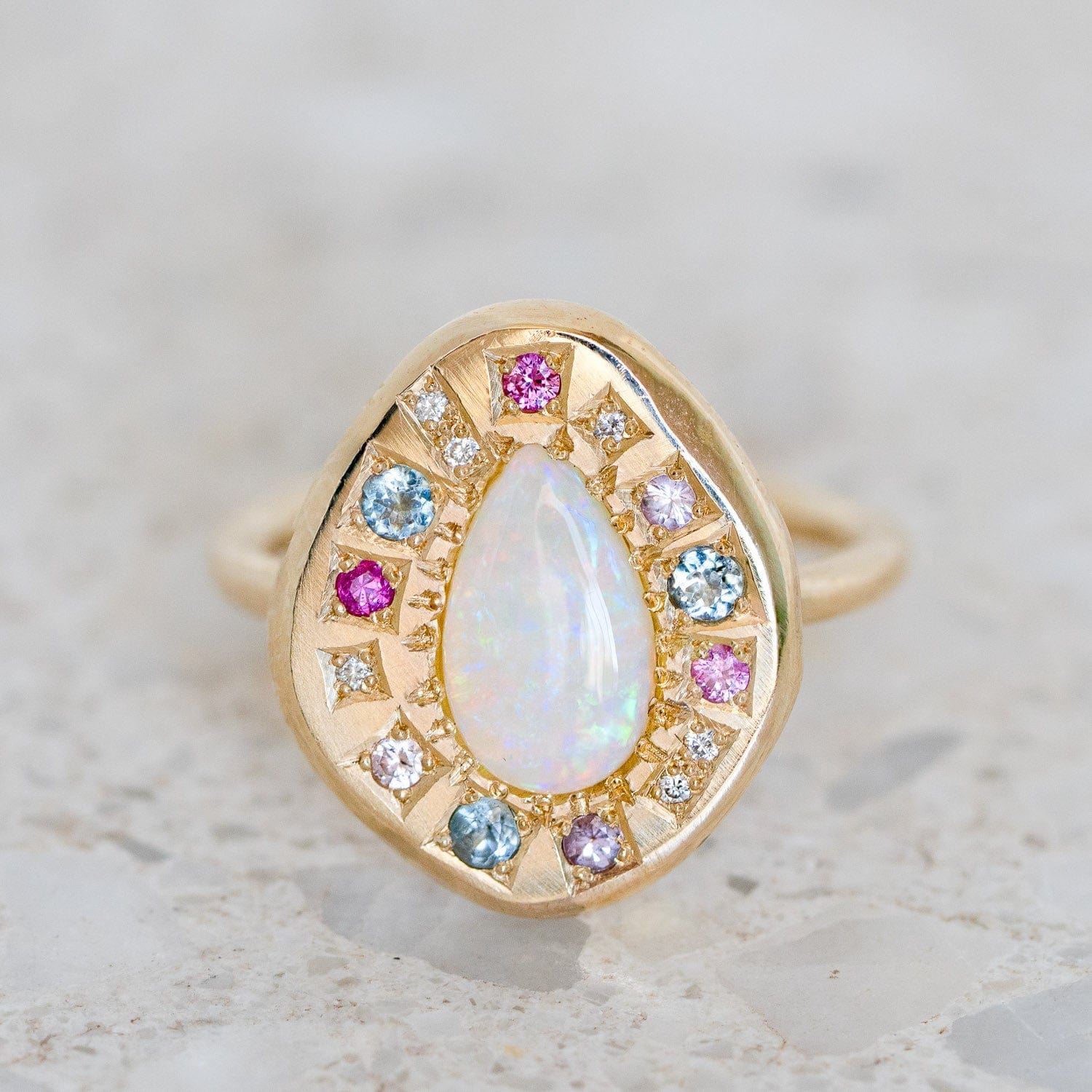 Luxury Promise Crystal Opal surrounded by pink sapphires, aquamarines and diamonds set in 14K Yellow Gold