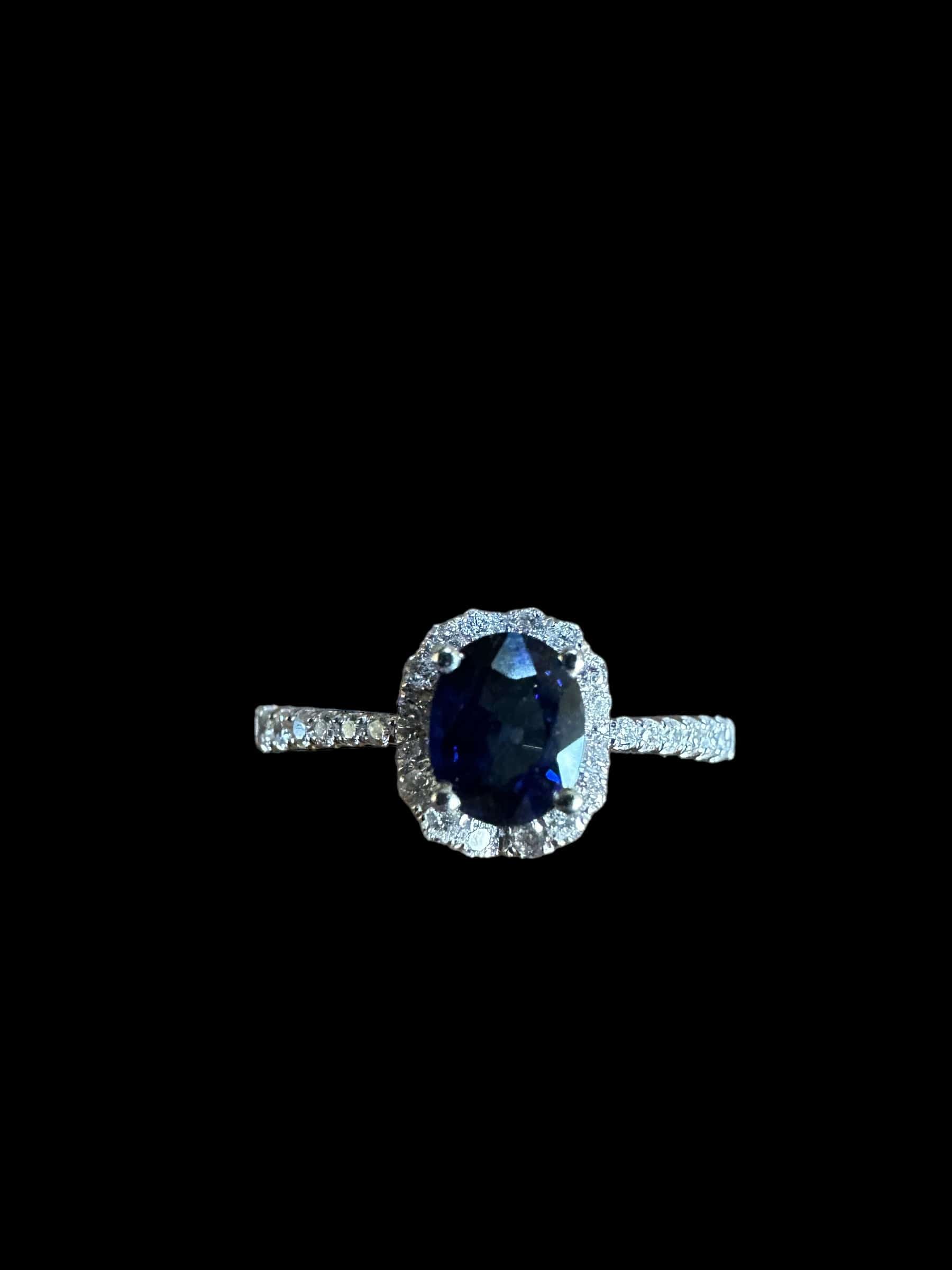 Luxury Promise Oval Sapphire Ring surrounded with White diamonds and on Band set in 18K White Gold