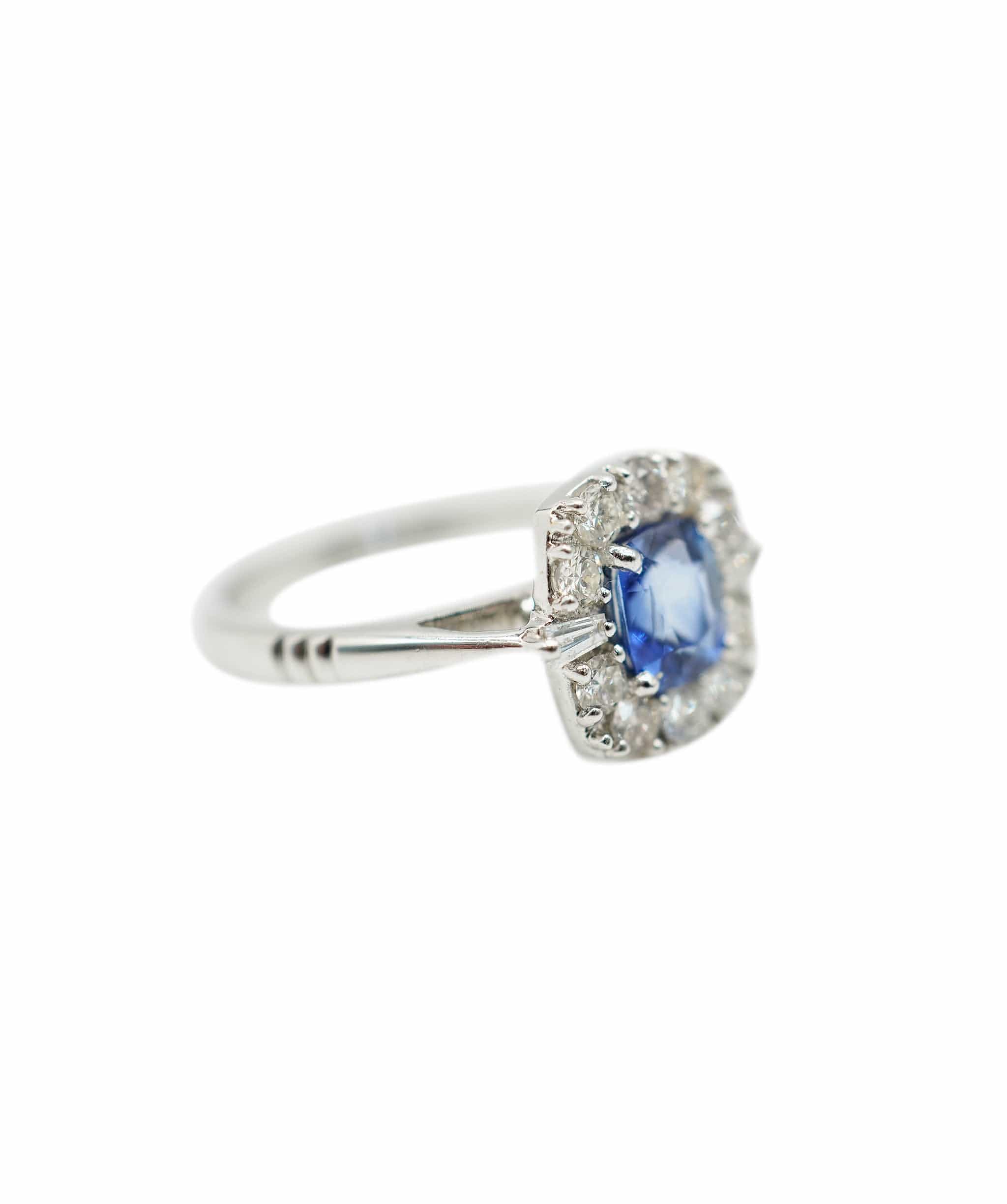 N/A Sapphire (0.95ct) and diamond (apx 0.45ct total) cluster ring 18K WG AHC1191