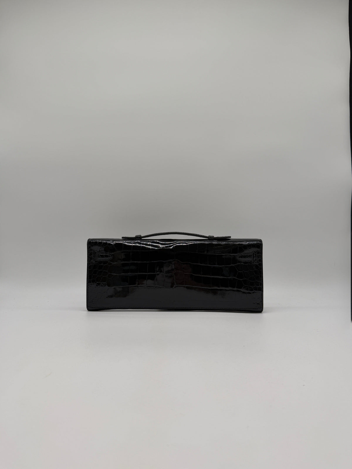 Prime Concierge Hermès Kelly Cut Black Shiny Porosus Palladium Hardware