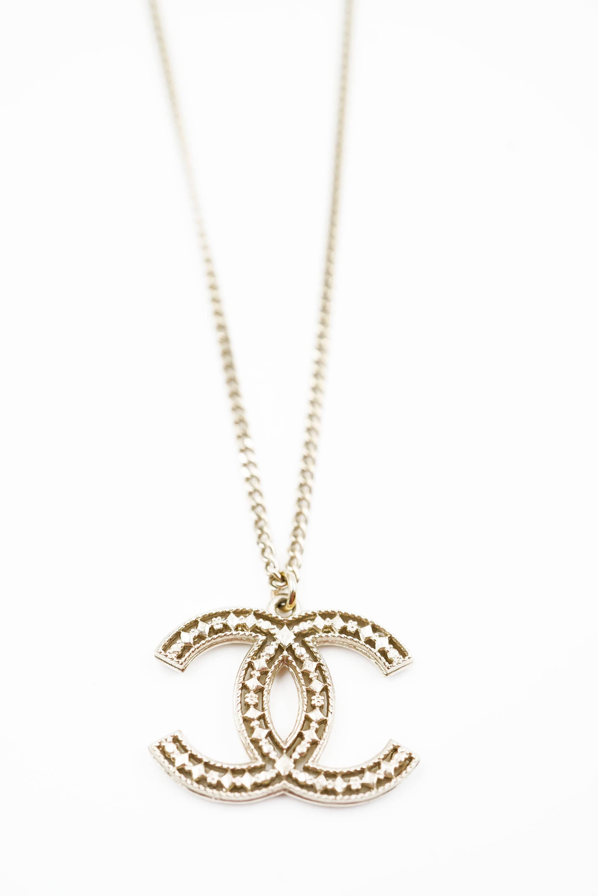 Chanel Chanel CC gold filagree cut out background - AWL4178