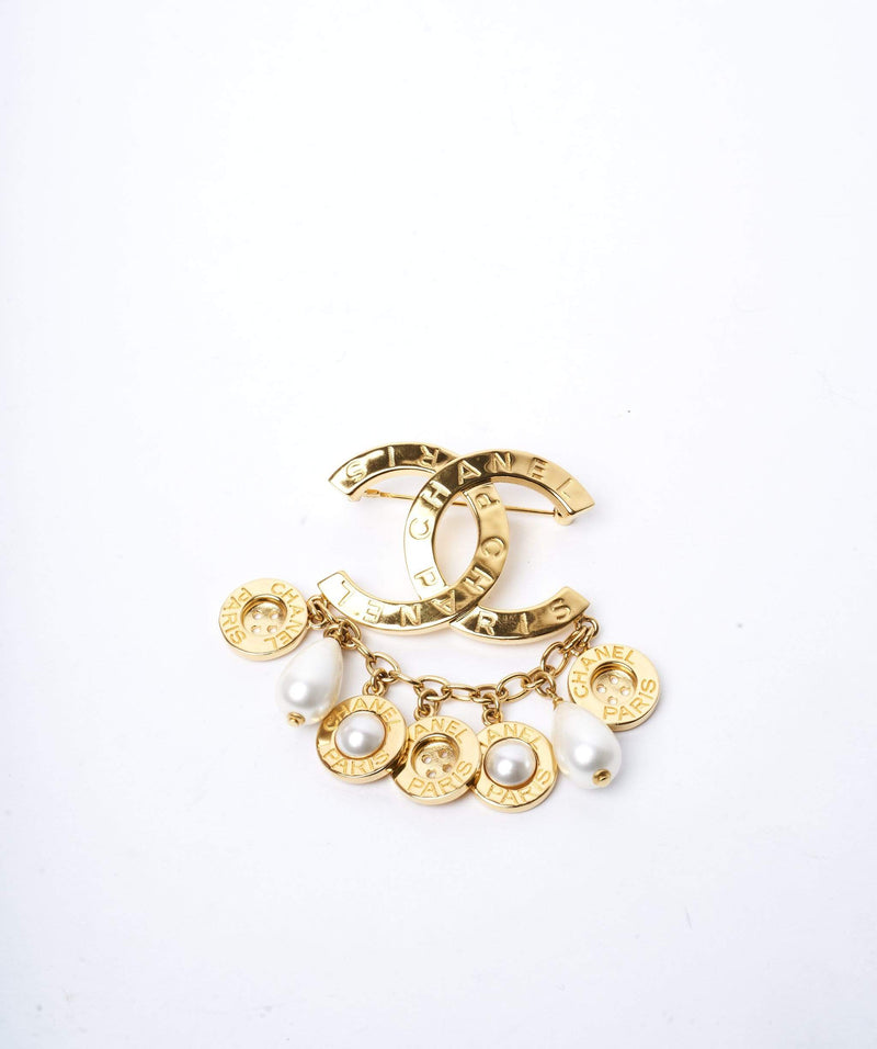 Chanel Chanel CC gold pearl buttoned drop brooch