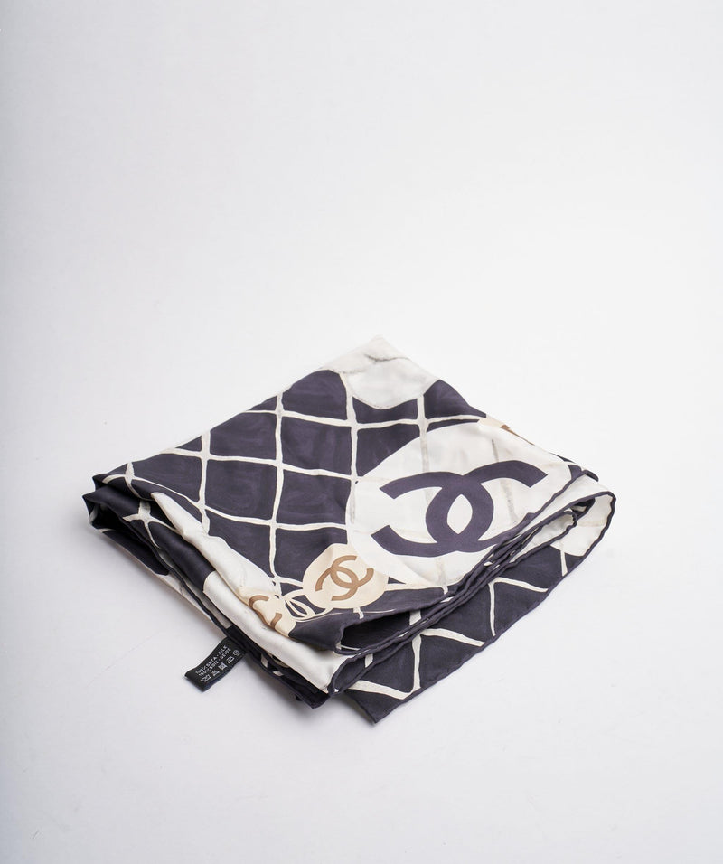 Chanel A Small Silk Scarf. A Black Scarf With A White