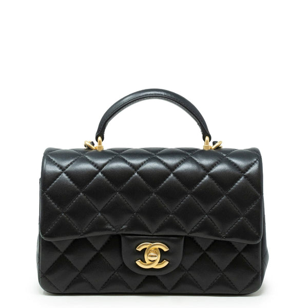 Chanel mini coco top handle in black lambskin with champagne