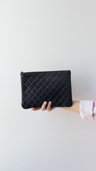 New Condition- Chanel Clutch in black patent quilted leather