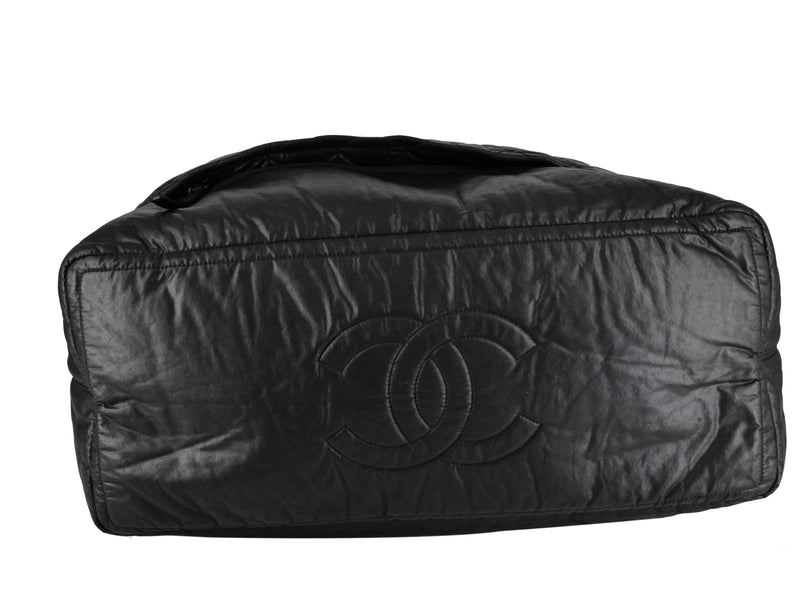 A BLACK NYLON QUILTED COCO COCOON ROLLING BAG, CHANEL, 2012