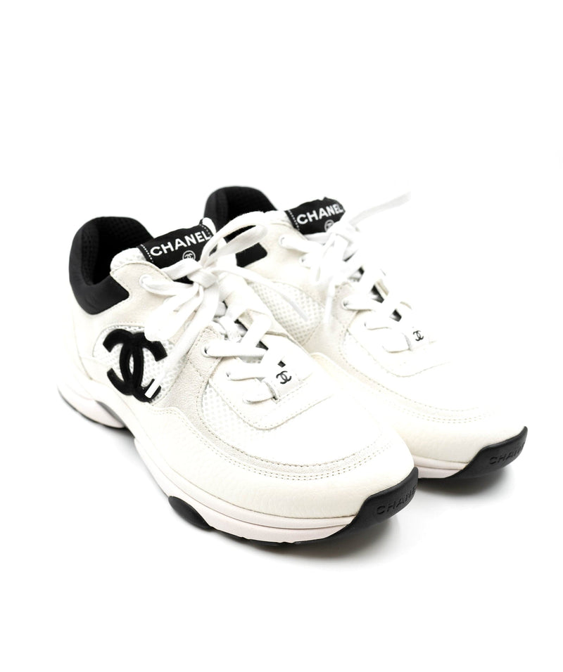 Chanel White Sneakers - 38.5 – LuxuryPromise