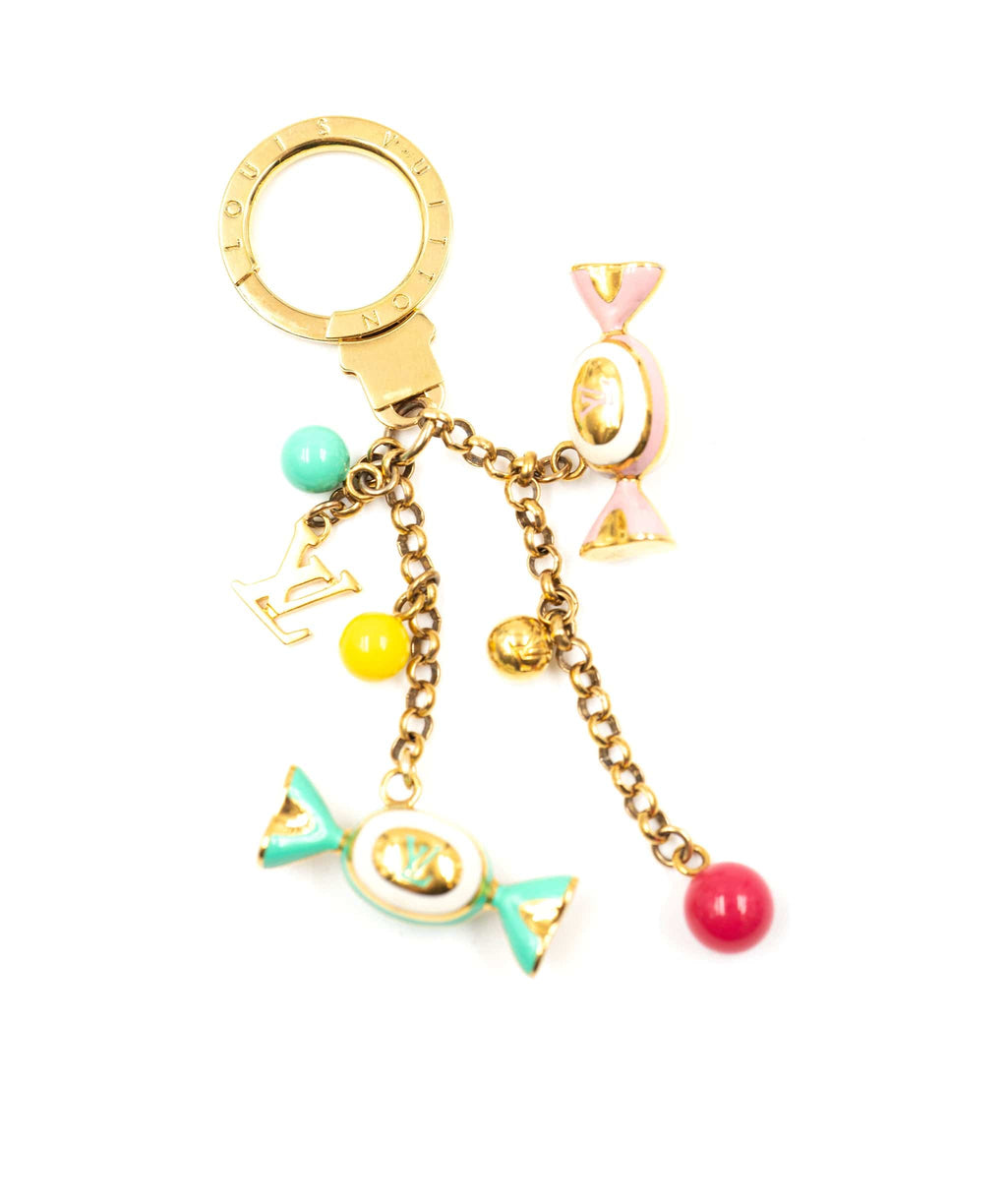 Golden Louis Vuitton Keychain with a golden keyring, vector, color