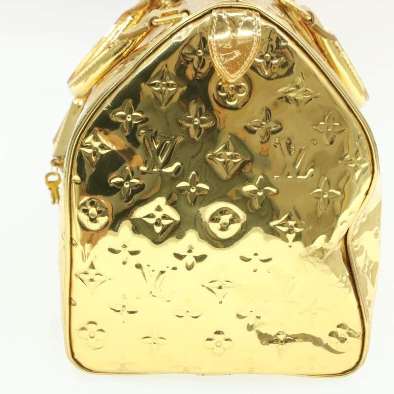 Speedy vinyl handbag Louis Vuitton Gold in Vinyl - 32806497