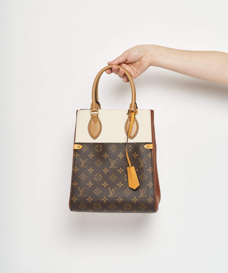 Louis Vuitton Louis Vuitton Rectangular Monogram and tan top handle bag
