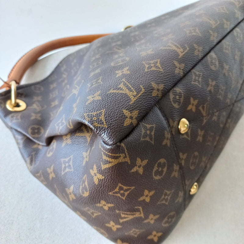 Elevate Your Style with The Louis Vuitton Monogram Artsy Handbag | Dress Raleigh